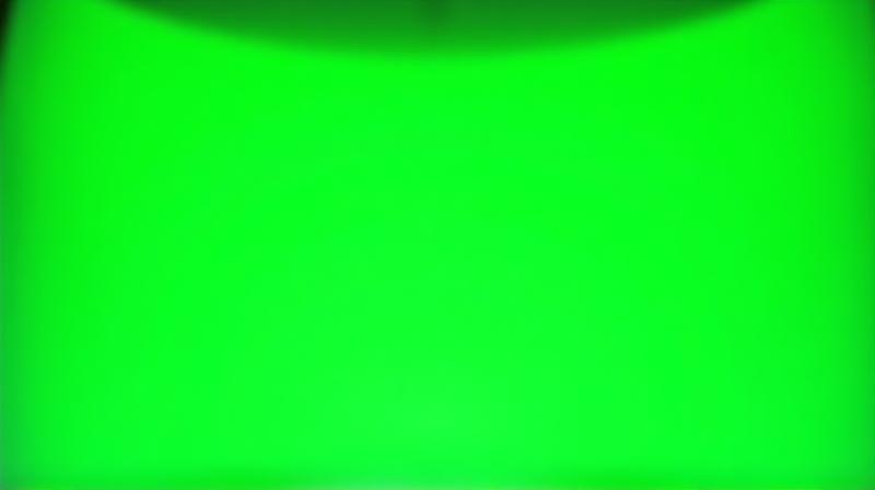 A large green screen cyclorama wall spanning a studio corner, ready for chroma key effects.